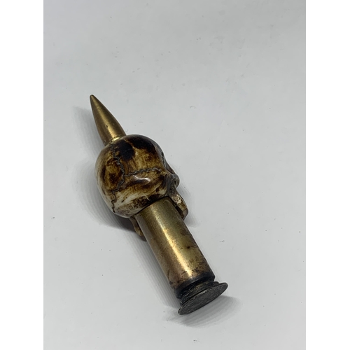 480A - A TRENCH ART BONE SKULL AND BULLET