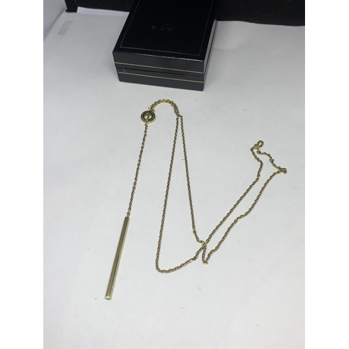 569 - A MICHAEL KORS YELLOW METAL NECKLACE IN A PRESENTATION BOX