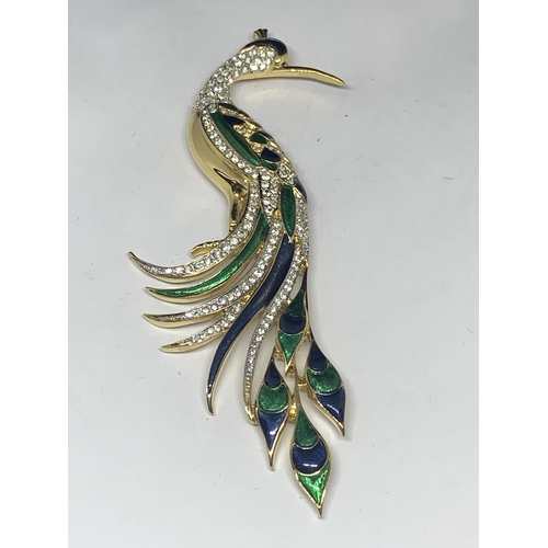 578 - A LARGE RHINESTONE STUDDED PEACOCK BROOCH