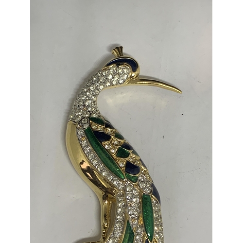 578 - A LARGE RHINESTONE STUDDED PEACOCK BROOCH