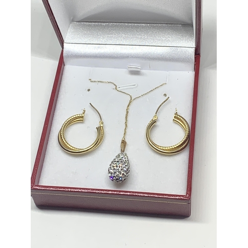 589 - THREE MARKED 9 CARAT GOLD ITEMS TO INCLUDE A PAIR OF HOOP EARRINGS AND A NECKLACE WITH CRYSTAL DROP ... 