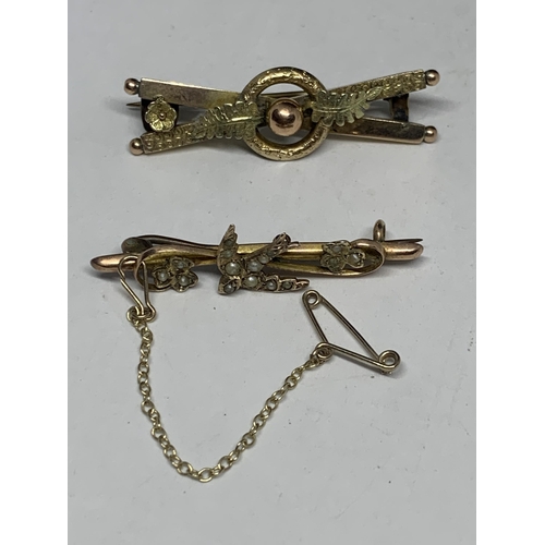 591 - TWO VINTAGE MARKED 9 CARAT GOLD BROOCHES ONE WITH A SEED PEARL SWALLOW DESIGN AND SAFETY CHAIN