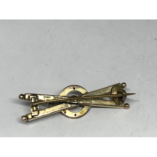 591 - TWO VINTAGE MARKED 9 CARAT GOLD BROOCHES ONE WITH A SEED PEARL SWALLOW DESIGN AND SAFETY CHAIN