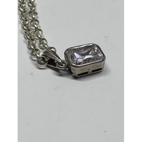 595 - A MARKED SILVER BELCHER CHAIN NECKLACE WITH A CLEAR STONE PENDANT IN A CASE