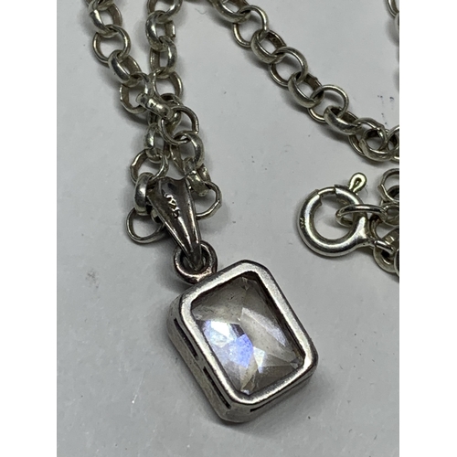 595 - A MARKED SILVER BELCHER CHAIN NECKLACE WITH A CLEAR STONE PENDANT IN A CASE