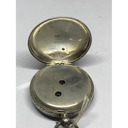 601 - A MARKED 800 SILVER POCKET WATCH WITH DECORATIVE WHITE ENAMAL FACE, SUB DIAL AND ROMAN NUMERALS