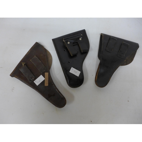 275 - THREE LEATHER PISTOL HOLSTERS