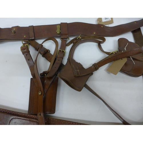 283 - A LEATHER SAM BROWNE BELT, TWO SWORD ATTACHMENTS, TWO POUCHES AND A CARTRIDGE BELT