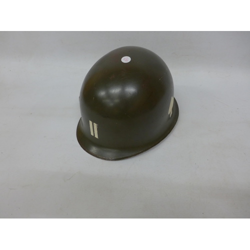 286 - A USA GREEN PAINTED MILITARY HELMET AND LINER WITH PAINTED DECORATION OF OFFICER BARS, MARKED EASYCO