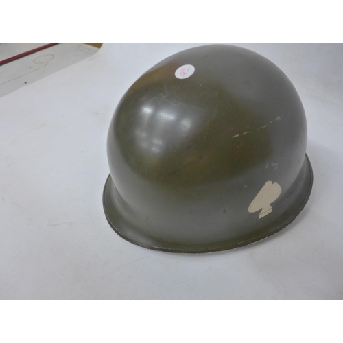 286 - A USA GREEN PAINTED MILITARY HELMET AND LINER WITH PAINTED DECORATION OF OFFICER BARS, MARKED EASYCO