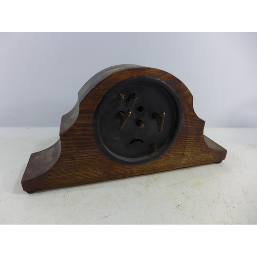 457 - AN OAK CARVED MANTEL CLOCK, 9.5CM SILVERED DIAL