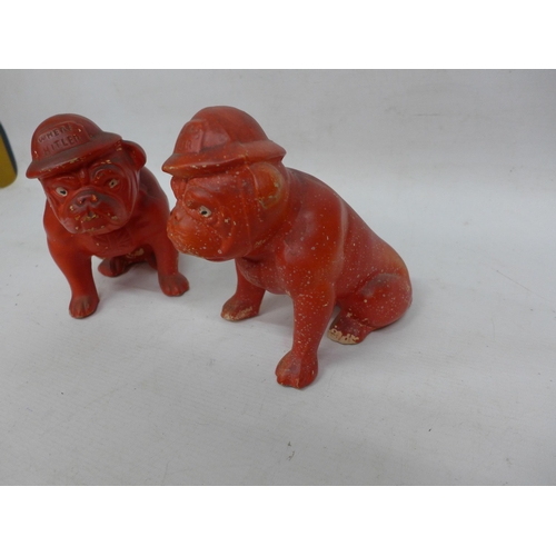 490 - A RARE PAIR OF WORLD WAR II PAINTED POTTERY FIGURES OF BRITISH BULLDOGS WEARING TIN HATS WITH THE WO... 