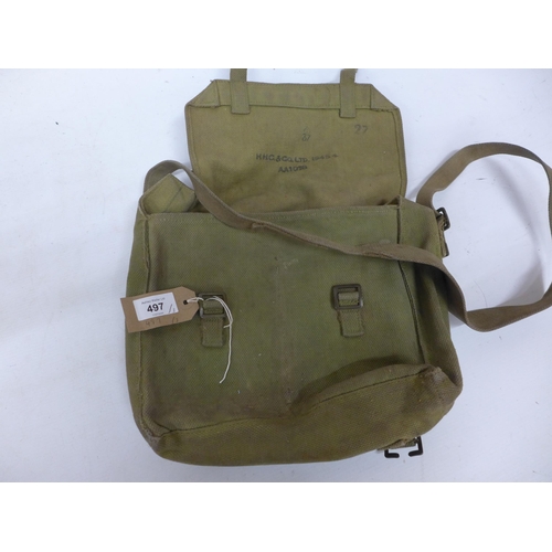 497 - A WORLD WAR II CANVAS KNAPSACK DATED 1945, WITH TWO FURTHER CANVAS BAGS