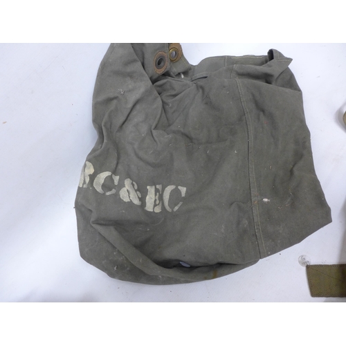 497 - A WORLD WAR II CANVAS KNAPSACK DATED 1945, WITH TWO FURTHER CANVAS BAGS