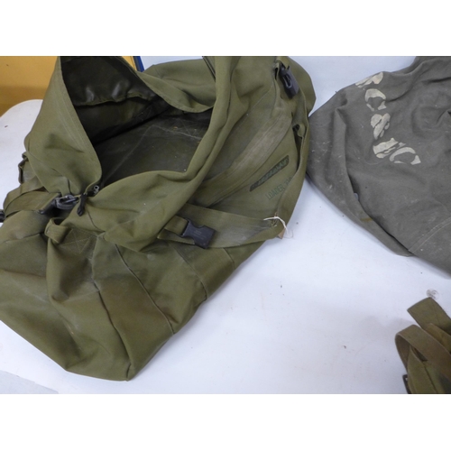 497 - A WORLD WAR II CANVAS KNAPSACK DATED 1945, WITH TWO FURTHER CANVAS BAGS