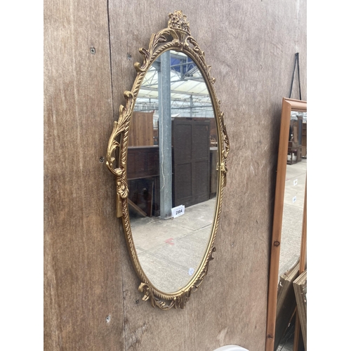 2984 - AN OVAL GILT METAL EFFECT WALL MIRROR, 26