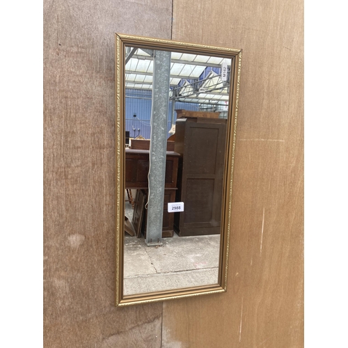 2988 - A SMALL GILT EFFECT WALL MIRROR, 23.5