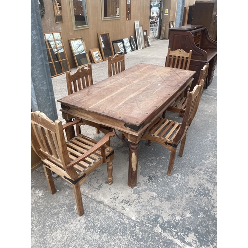 3002 - A HARDWOOD DINING TABLE WITH METAL STUDS AND STRAPS ON TURNED LEGS, 77