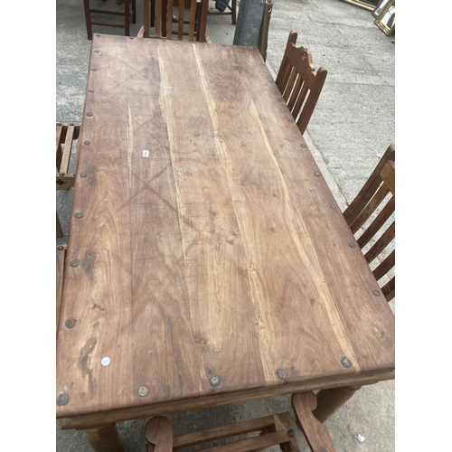 3002 - A HARDWOOD DINING TABLE WITH METAL STUDS AND STRAPS ON TURNED LEGS, 77