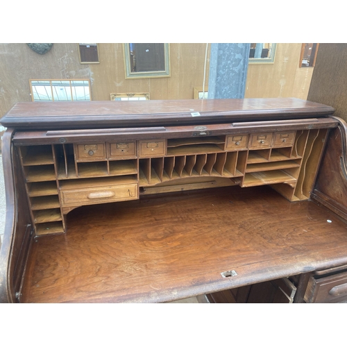 3003 - AN EARLY 20TH CENTURY TWIN-PEDESTAL MAHOGANY ROLL-TOP DESK ENCLOSING EIGHT DRAWERS AND TWO SLIDES, 6... 