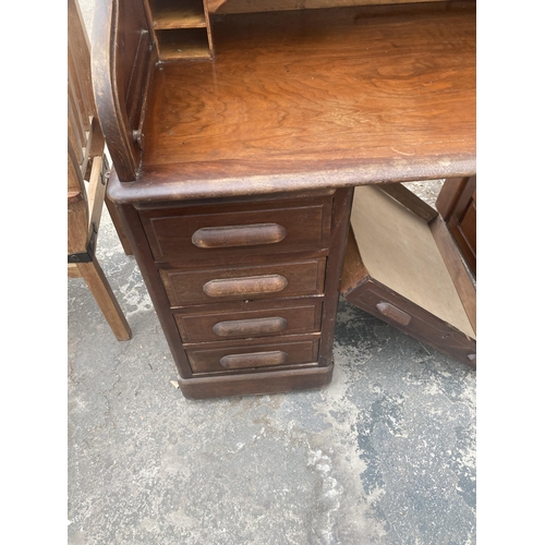 3003 - AN EARLY 20TH CENTURY TWIN-PEDESTAL MAHOGANY ROLL-TOP DESK ENCLOSING EIGHT DRAWERS AND TWO SLIDES, 6... 