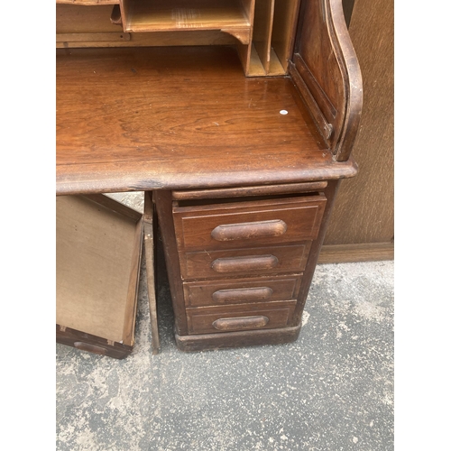 3003 - AN EARLY 20TH CENTURY TWIN-PEDESTAL MAHOGANY ROLL-TOP DESK ENCLOSING EIGHT DRAWERS AND TWO SLIDES, 6... 