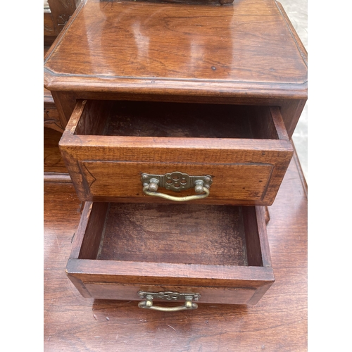 3010 - A LATE VICTORIAN CEDAR DUCHESS DRESSING TABLE, 47