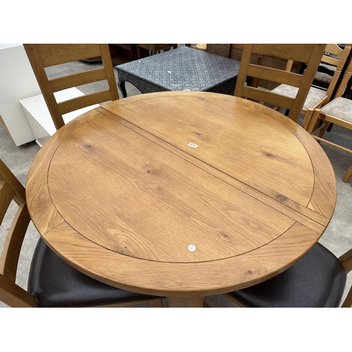 3019 - A 'MORRIS FURNITURE' OAK EXTENDING DINING TABLE, 43