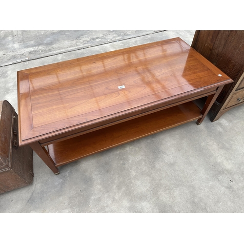 3032 - A CHERRY WOOD TWO TIER COFFEE TABLE WITH BRASS FEET, 47