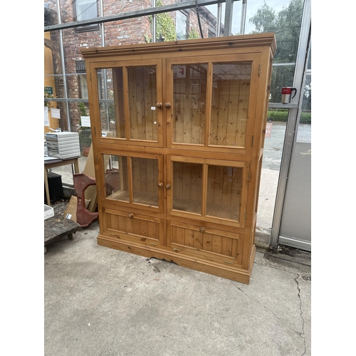 3018 - A PINE FOUR DOOR DISPLAY CABINET WITH CUPBOARDS TO BASE, 63