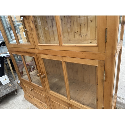 3018 - A PINE FOUR DOOR DISPLAY CABINET WITH CUPBOARDS TO BASE, 63