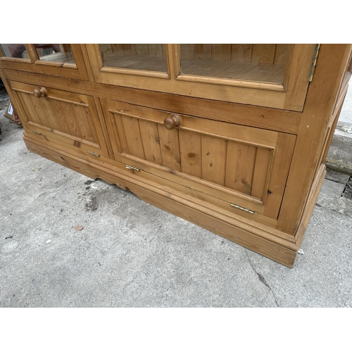 3018 - A PINE FOUR DOOR DISPLAY CABINET WITH CUPBOARDS TO BASE, 63