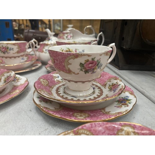 33 - A ROYAL ALBERT LADY CARLYLE TEASET TO INCLUDE TEAPOT, SUGAR AND CREAMER, CAKE PLATE, FIVE TRIO, SAUC... 