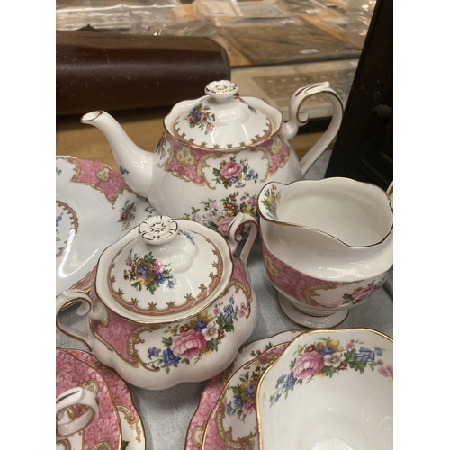 33 - A ROYAL ALBERT LADY CARLYLE TEASET TO INCLUDE TEAPOT, SUGAR AND CREAMER, CAKE PLATE, FIVE TRIO, SAUC... 