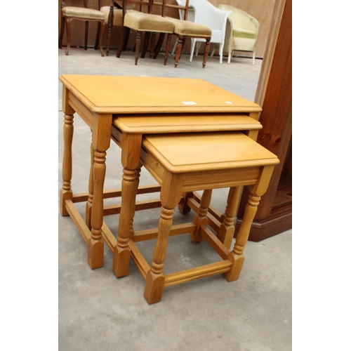 3037 - AN OAK NEST OF THREE TABLES