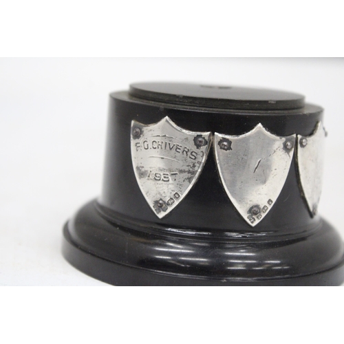 111 - A TROPHY BASE WITH HALLMARKED SILVER PRESENTATION SHIELDS