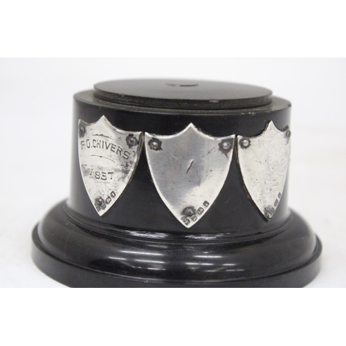 111 - A TROPHY BASE WITH HALLMARKED SILVER PRESENTATION SHIELDS