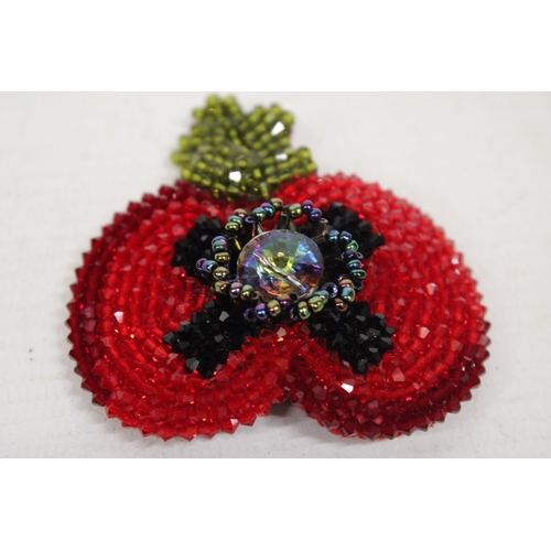 598A - A KLESHNA BEADED POPPY BROOCH IN ORIGINAL PRESENTATION BOX