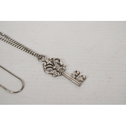 609 - TWO SILVER NECKLACES ONE WITH KEY PENDANT