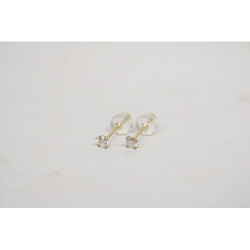 610 - A PAIR MARKED 18K AND DIAMOND EARRINGS IN A PRESENTATION CASE