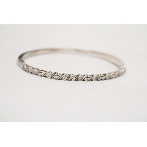 615 - A PANDORA MARKED SILVER AND CLAER STONE BANGLE IN ORIGINAL PRESENTATION BOX