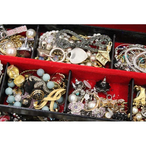 91 - A LARGE QUANTITY OF COSTUME JEWELLERY TO INCLUDE WATCHES, BROOCHES, BRACELETS, NECKLACES, EARRINGS, ... 