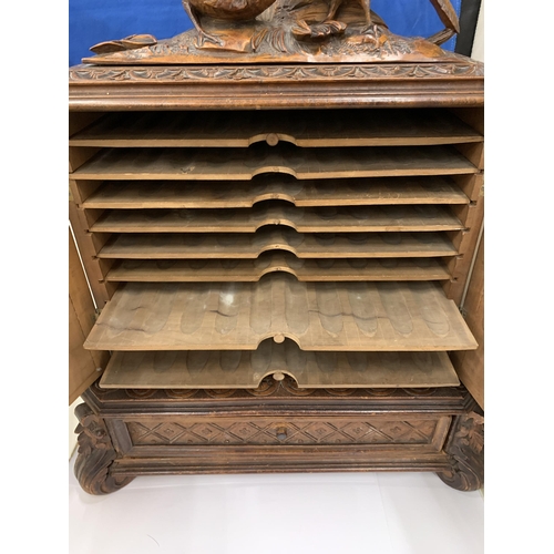 3 - A HEAVILY CARVED ANTIQUE WALNUT BLACK FOREST CIGAR HUMIDOR WITH BIRD DECORATION AND LOWER DRAWER