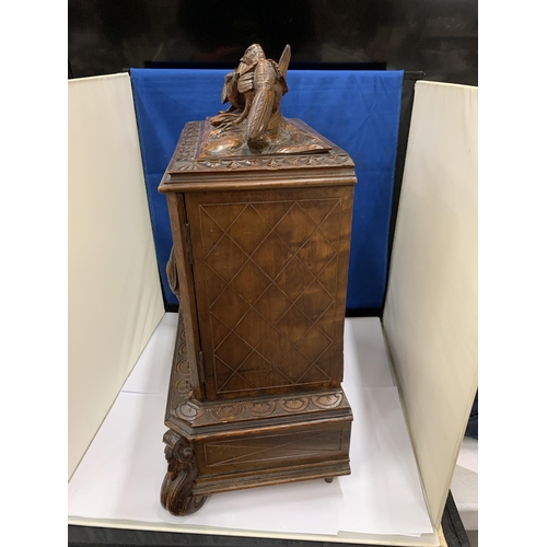 3 - A HEAVILY CARVED ANTIQUE WALNUT BLACK FOREST CIGAR HUMIDOR WITH BIRD DECORATION AND LOWER DRAWER