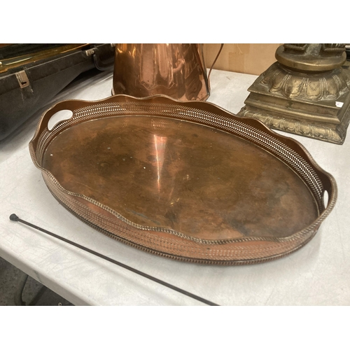 42 - A LATE VICTORIAN LARGE OVAL COPPER TRAY WITH GARDROONED RIM AND BUN FEET 52 X 34 CM