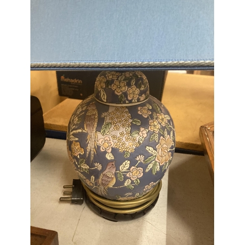 46 - AN ORIENTAL LAMP BASE WITH BLUE SHADE