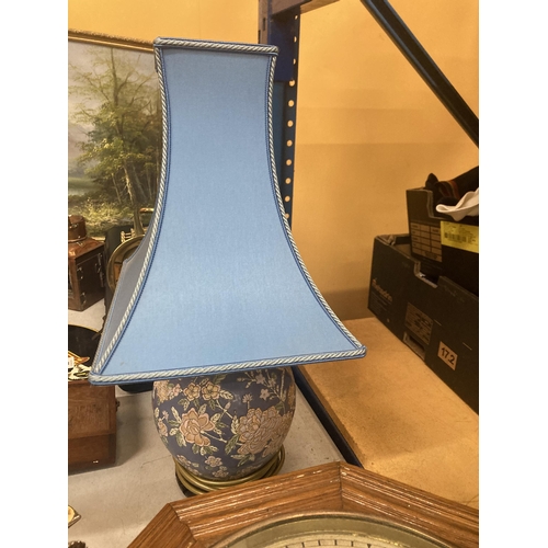 46 - AN ORIENTAL LAMP BASE WITH BLUE SHADE