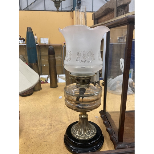 65 - A VINTAGE BRASS OIL LAMP WITH GLASS RESERVOIR, OPAQUE ETCHED GLASS SHADE AND FUNNEL, HEIGHT APPROX 5... 