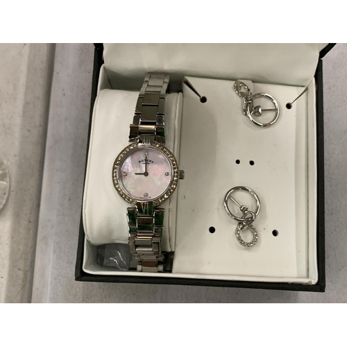 209 - A ROTARY LADIES WRISTWATCH WITH MOTHER OF PEARL FACE AND METAL STRAP, TOGETHER WITH A PAIR OF EARRIN... 