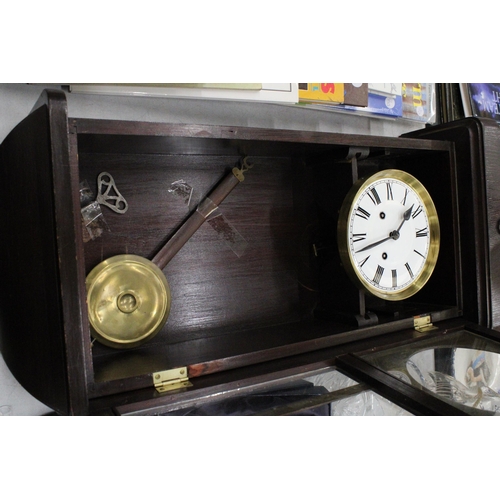 256 - A MAHOGANY CASED WALL CLOCK WITH PENDULUM AND KEY